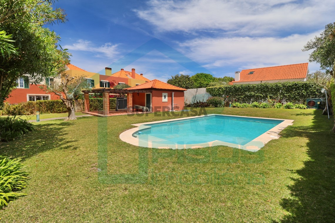Heated communal pool and manicured green areas