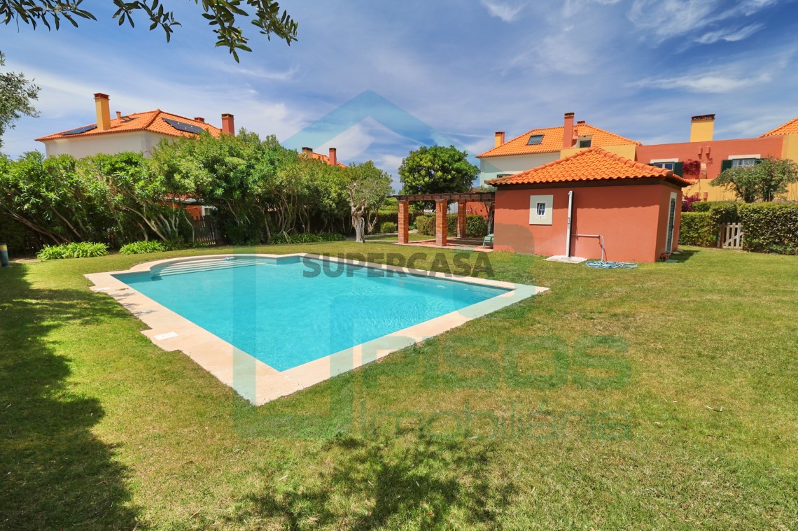 Heated communal pool and manicured green areas