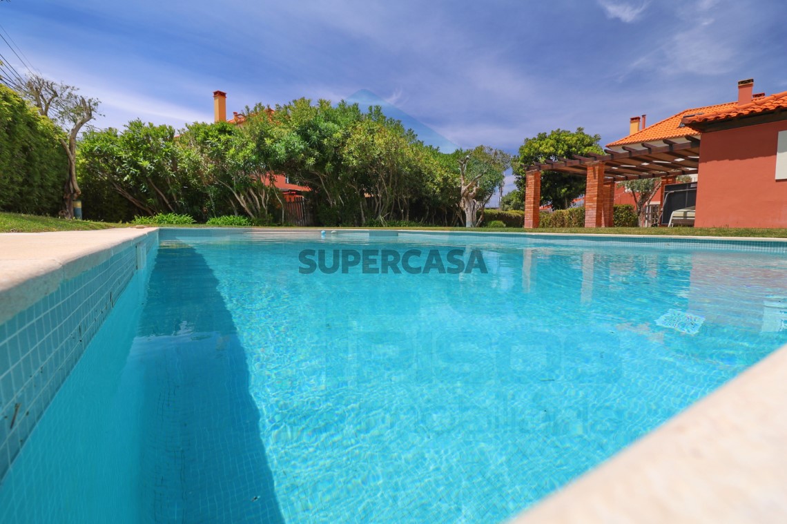 Heated communal pool and manicured green areas
