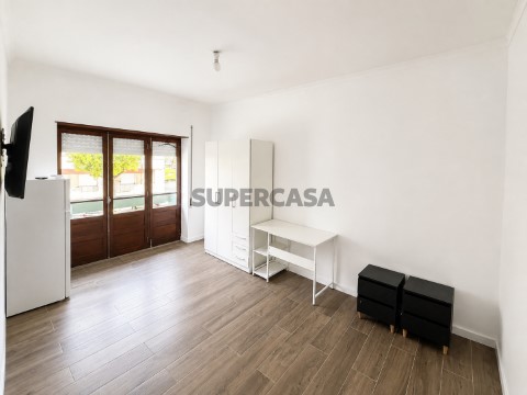 Bright Minimalist Room with Sunlit Balcony Doors 2